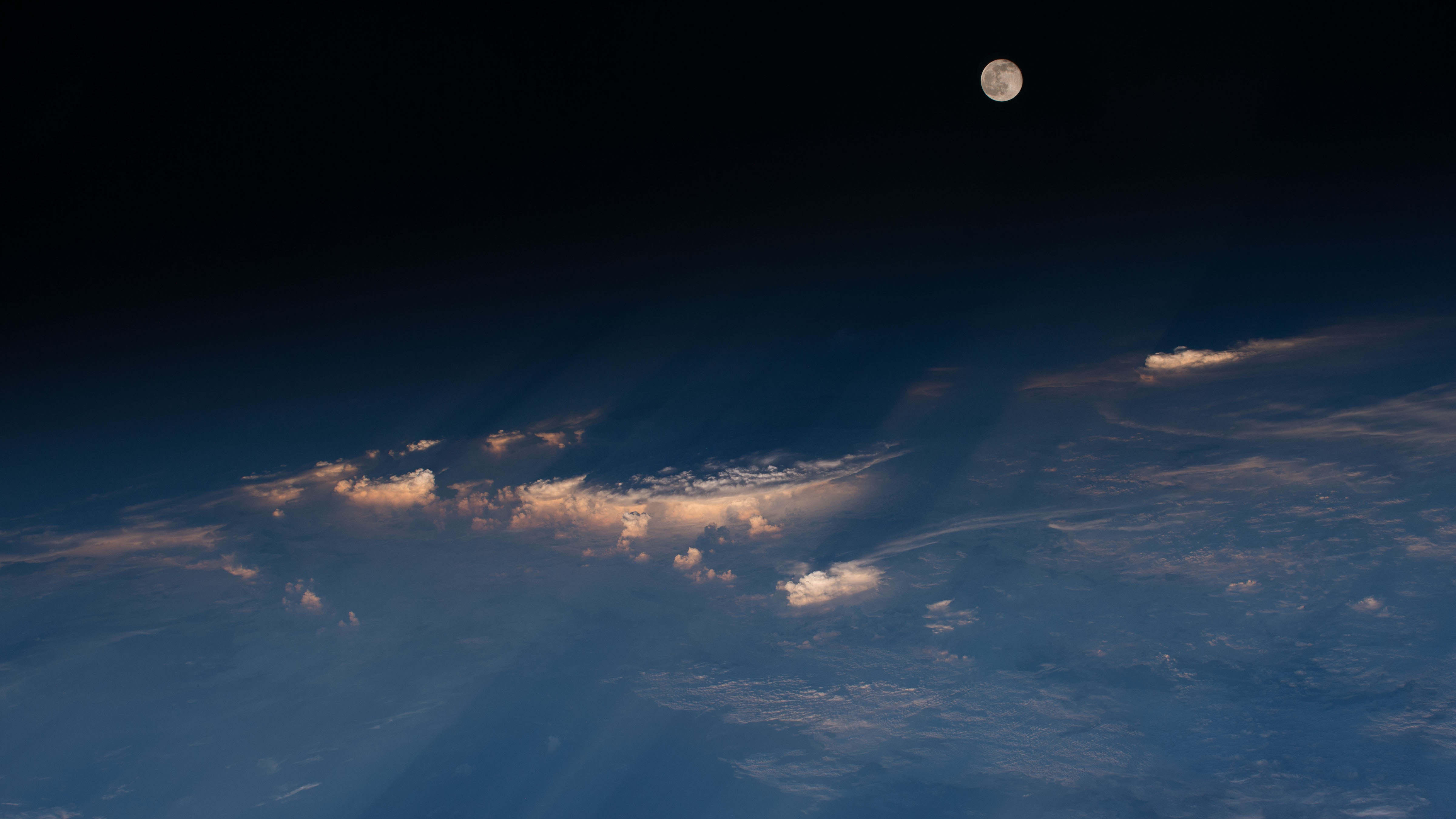 Full moon rising over western China, photographed from the International Space Station